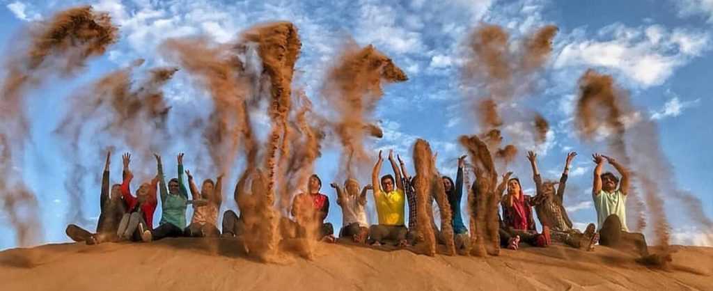 Tourists Varzaneh desert sand