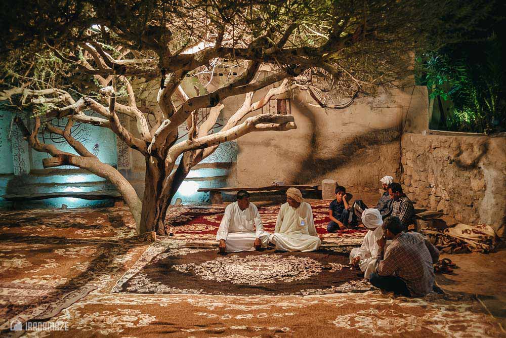 Qeshm men sitting under tree