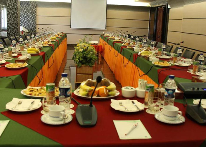 The conference hall of Hoizeh hotel in Tehran with the latest modern facilities and tables arranged for reception
